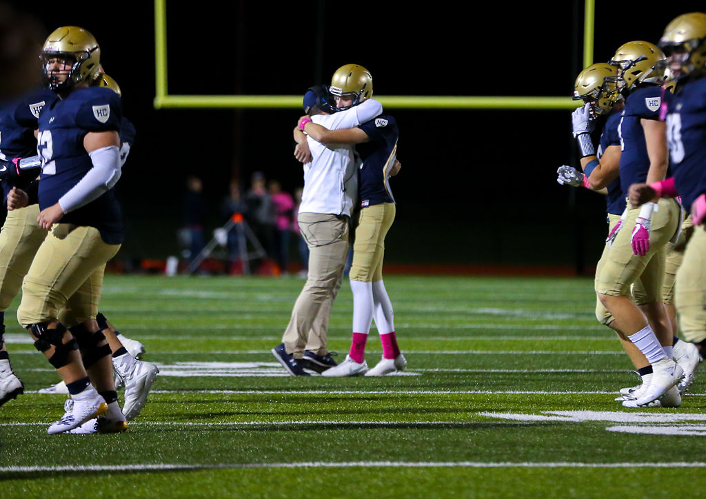 Vito Calvaruso receives a hug from a coach